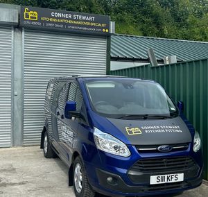 Conner Stewart Kitchen Fitting work van parked outside their office.