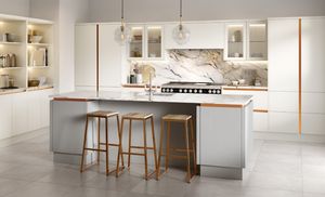 Conner Stewart modern kitchen with white cabinets and wood accents.