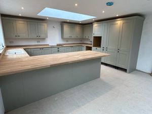 modern-kitchen-with-large-wooden-counter-top.jpg