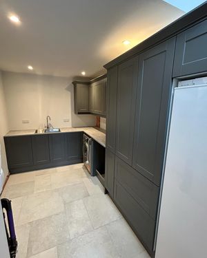 kitchen-with-grey-cupboards-and-tiled-floor.jpg
